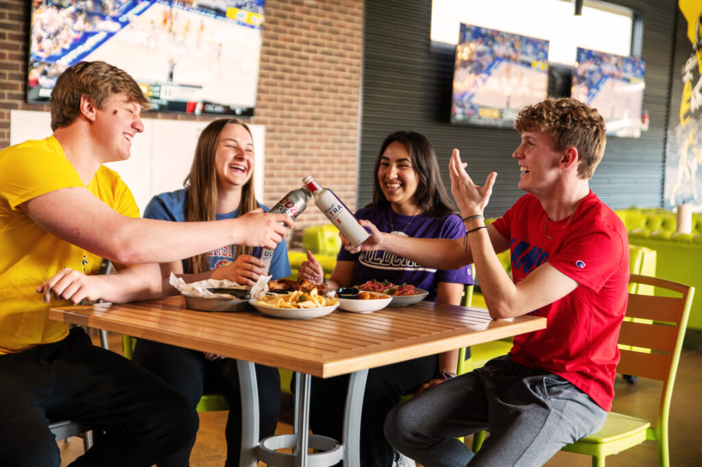 Friends watching college sports