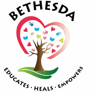 A logo with the word BETHESDA above a tree inside a pink heart. Colorful hearts, handprints, and books surround the tree, symbolizing giveback and benefiting vets for youth. EDUCATES · HEALS · EMPOWERS appears in a curve below the image.