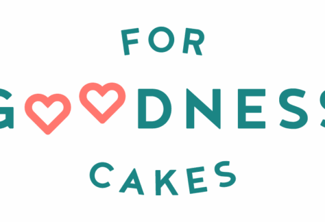 Logo with the words For Goodness Cakes, featuring pink heart-shaped Os in Goodness. The teal text on a light background highlights their giveback mission, benefiting vets and youth in the community.