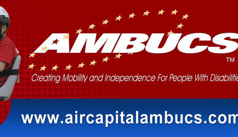 Two children with helmets ride adaptive bikes against a red background. White and yellow text reads AMBUCS Creating Mobility and Independence For People With Disabilities—giveback initiatives benefiting vets and youth. Website: www.aircapitalambucs.com.