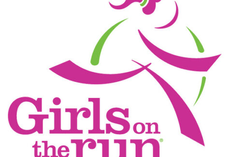Logo for Girls on the Run, featuring a stylized figure of a girl running in pink and green, with the words "Girls on the Run" in bold pink and purple letters below—giveback benefiting vets for youth programs.