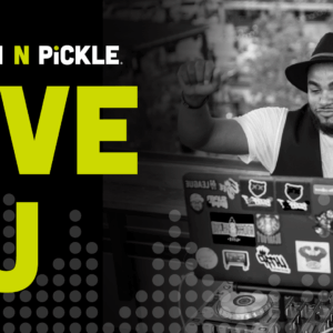 A DJ wearing a hat and vest raises his arms while performing outdoors. The text reads Chicken N Pickle. LIVE DJ in bold yellow and white letters next to the image.