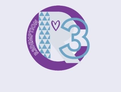 A circular logo featuring a bold purple R and blue 3, with a violet heart, blue triangle patterns, and "R3DEMPTION" written vertically on the left side—symbolizing Giveback Benefiting Vets for Youth.