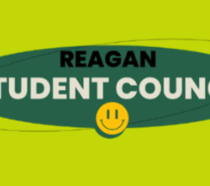 Green oval with “REAGAN STUDENT COUNCIL” in bold white and black letters, a yellow background, two black stars, and a yellow smiley face below the text.