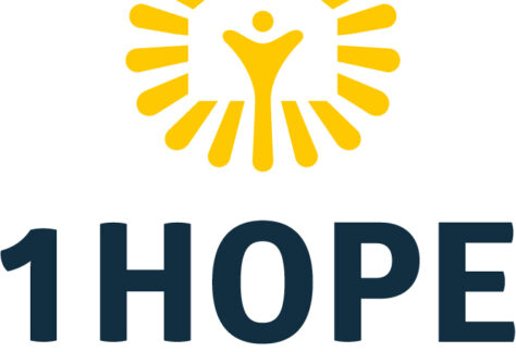 Logo for 1HOPE FOR KIDS featuring a stylized yellow sunburst with a figure in the center, above the text “1HOPE FOR KIDS” in bold, dark blue letters—benefiting vets and inspiring hope for youth.