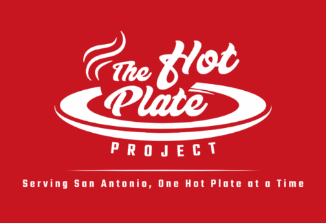 White logo for The Hot Plate Project on a red background, featuring steam rising from a plate. Text below reads: Serving San Antonio, One Hot Plate at a Time—Giveback Benefiting Vets and support for Youth.