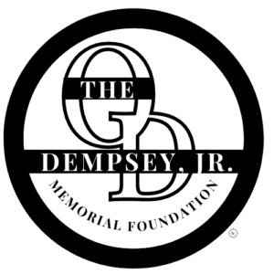 Black and white circular logo with the letters OD in the center, THE above, DEMPSEY, JR. across the middle, MEMORIAL FOUNDATION around the bottom—symbolizing a commitment to giveback benefiting vets and youth.