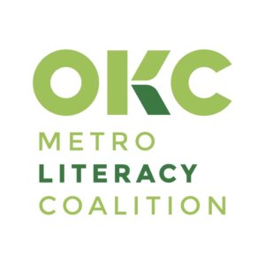 Logo with green text reading OKC METRO LITERACY COALITION. OKC is bold, with METRO and COALITION in lighter green, LITERACY in a darker shade. Designed for a Giveback Benefiting Vets for Youth. White background.