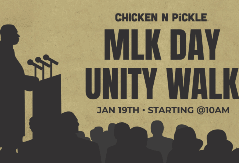 A silhouette of a person speaking at podiums faces an audience, with text: Chicken N Pickle. MLK Day Unity Walk. Jan 19th, starting @10am on a tan background.