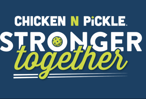 White and green text on a blue background reads Chicken N Pickle. Stronger together. The letter O and I are replaced with a pickleball paddle and ball. White lines underline the word together.