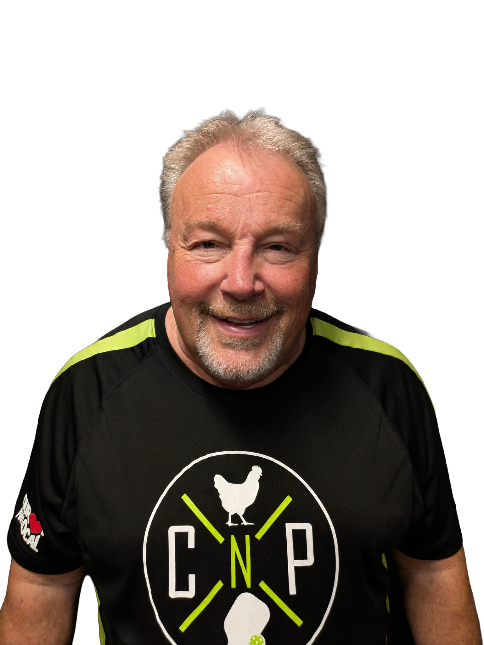 Smiling older man with short gray hair wearing a black T-shirt with green accents and a CNP logo featuring chickens. The background is plain white.