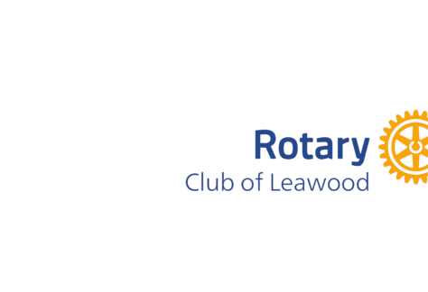 Rotary Club of Leawood logo featuring blue text and a yellow gearwheel symbol on a light background, highlighting their Giveback Benefiting Vets for Youth initiative.
