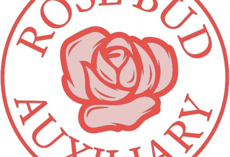 A red circular logo with the words ROSE BUD AUXILIARY surrounding an illustration of a rose in the center, symbolizing a giveback initiative benefiting Vets for Youth.