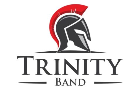 Logo featuring a Spartan helmet with a red crest above the bold text “Trinity Band.” Designed in black, grey, and red tones with horizontal lines, this logo represents a Giveback Benefiting Vets for Youth.