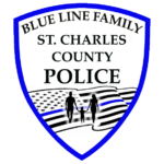 A police badge with a blue outline reads Blue Line Family St. Charles County Police above an American flag with a blue stripe and silhouettes of two adults and a child holding hands, highlighting a Giveback Benefiting Vets for Youth.