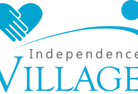 Logo for Independence Village featuring a stylized blue heart made of two hands, a gray word Independence, and large blue VILLAGE with a swoosh and dot above it, Benefiting Vets and designed to inspire Giveback for Youth in the community.