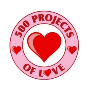 A pink circular badge with 500 Projects of Love written around a large red heart in the center, accented by three smaller red hearts—celebrating HELP of Southern Nevada Giveback Night.