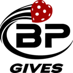 Logo with bold black letters BP encircled by a swoosh, topped with a red heart featuring white dots. Below, the black text reads GIVES. The design suggests a theme of generosity or charity.