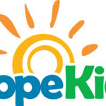 HopeKids logo with Hope in blue and Kids in green. An orange sun with rays rises behind the text, symbolizing positivity—perfect for events like the 10% Giveback Night at Chicken N Pickle NKC.