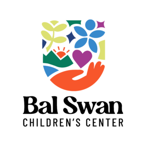 Colorful logo with flowers, a sun over hills, a heart, and an orange hand. Text below reads Bal Swan Childrens Center in bold black letters on a light background. Celebrate with us at the 10% Giveback to Bodhi Battalion Giveback Event at Chicken N Pickle!.