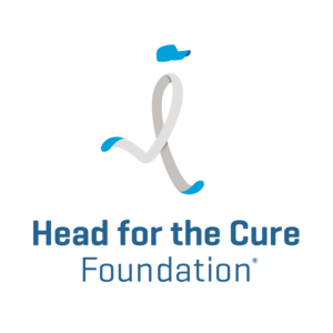 Logo of Head for the Cure Foundation, featuring a stylized ribbon resembling a running figure wearing a blue cap, with Head for the Cure Foundation text beneath it—a powerful symbol often seen at events like 10% Giveback Night at Chicken N Pickle NKC.