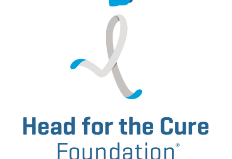 Logo of Head for the Cure Foundation, featuring a stylized ribbon resembling a running figure wearing a blue cap, with Head for the Cure Foundation text beneath it—a powerful symbol often seen at events like 10% Giveback Night at Chicken N Pickle NKC.