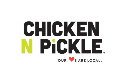 Chicken N Pickle logo with the words CHICKEN N PICKLE. The N and dot over the I are green, with the dot as a pickleball. Below, it says, OUR ♥S ARE LOCAL.