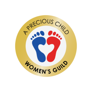 A gold circle logo with "A Precious Child Womens Guild" text and blue and red overlapping footprints forming a heart shape in the center, created in support of the 10% Giveback to Bodhi Battalion Giveback Event at Chicken N Pickle.