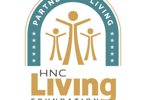 Logo for HNC Living Foundation showing three stylized human figures under an arch with blue background, stars, and the words PARTNERS IN LIVING. The text HNC Living Foundation appears below the graphic.
