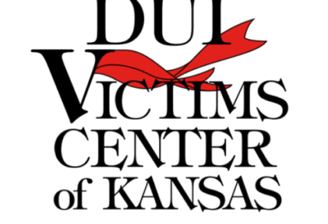 Logo for DUI Victims Center of Kansas with a red ribbon integrated into the letter V in Victims against a white background.